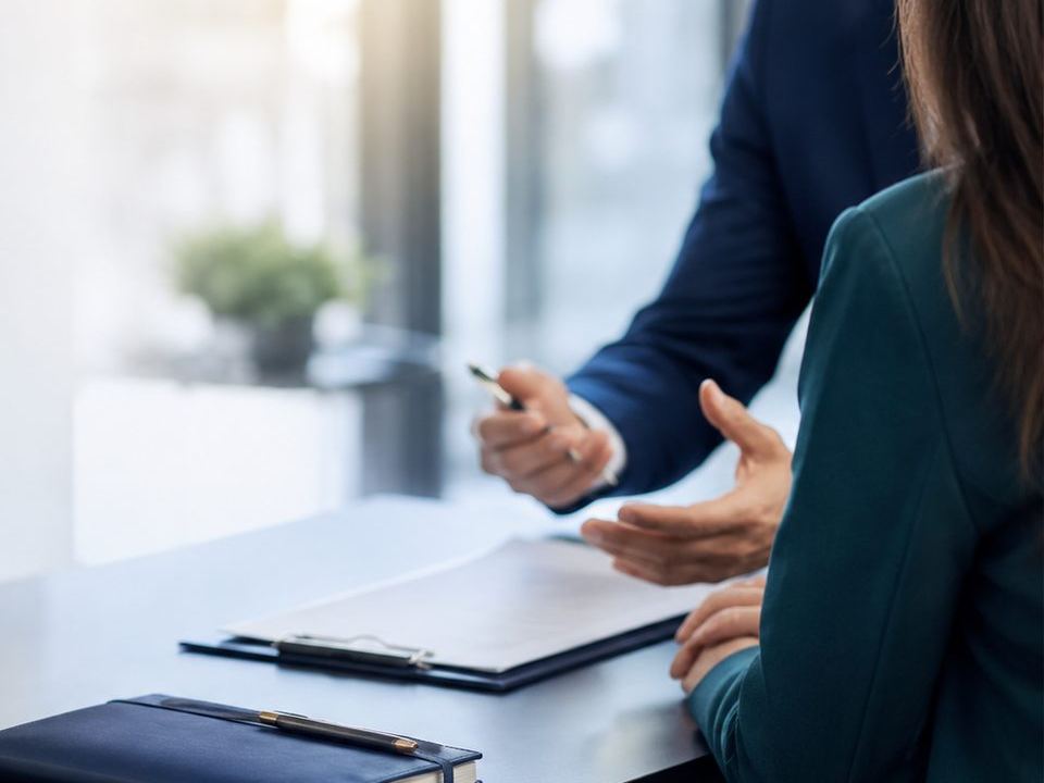 Consultation across a boardroom table